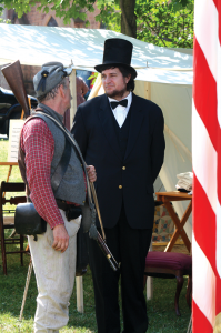 Robert Bushnell, of Fletcher, portraying President Abraham Lincoln, and Sgt. Randy McCullers, of Johnstown, N.Y., a Confederate soldier re-enactor chat during St. Albans Civil War Heritage Weekend in 2012.