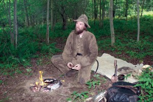 Tyler Goodrich of Berkshire cooks an afternoon meal using authentic Civil War-era food and gear on Thursday.