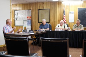 Warren Hamm, left, an organizer for the 2014 St. Albans Raid commemoration event talks on Aug. 12, 2013 with St. Albans Town Selectboard members, from left, Bill Nihan, Brent Palmer and Bernie Boudreau during Monday evening’s meeting.